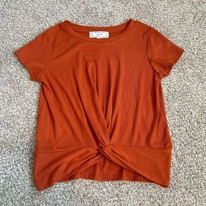 Woman’s orange Top